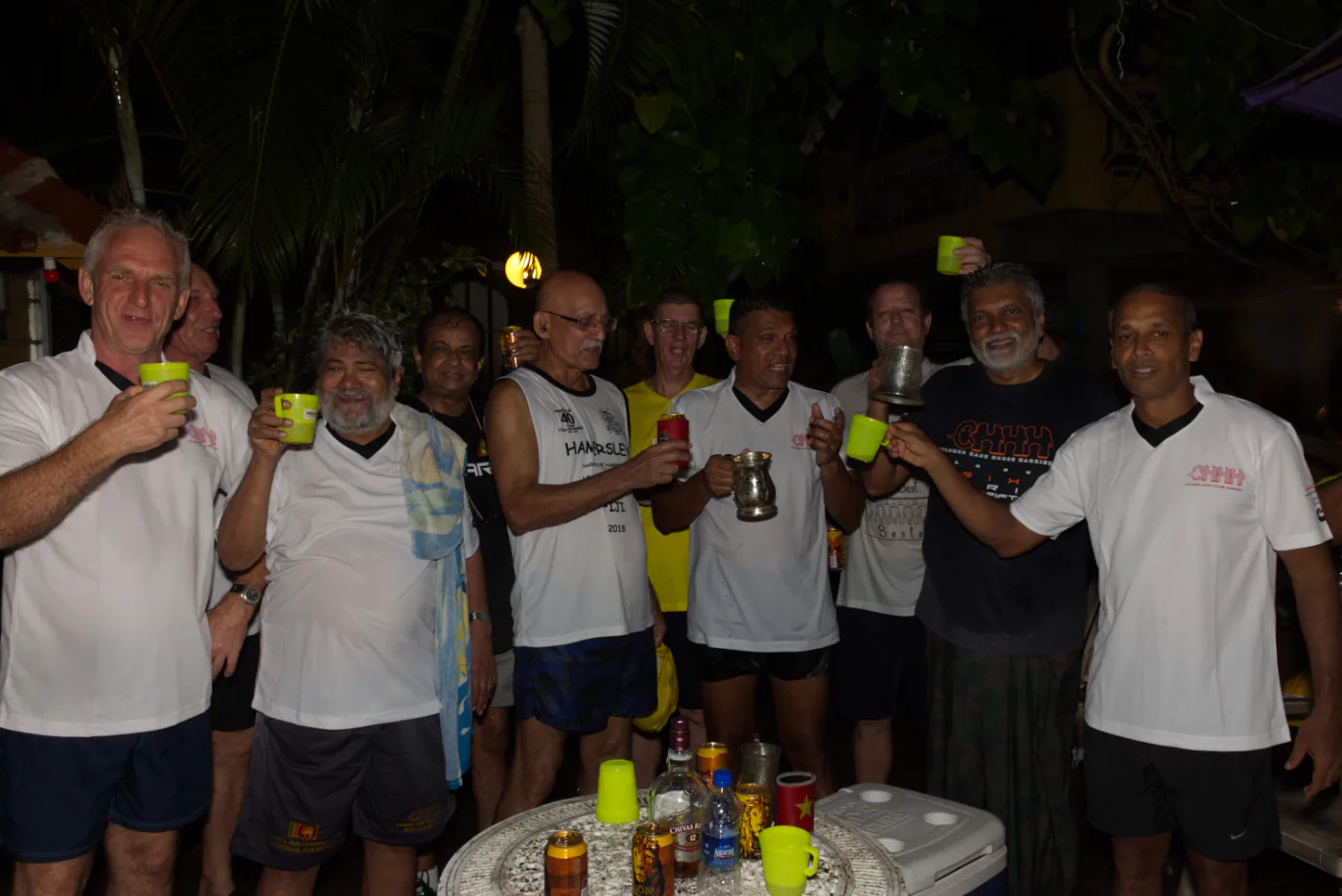 CH3 members raising drinks together at an outdoor On-On gathering
