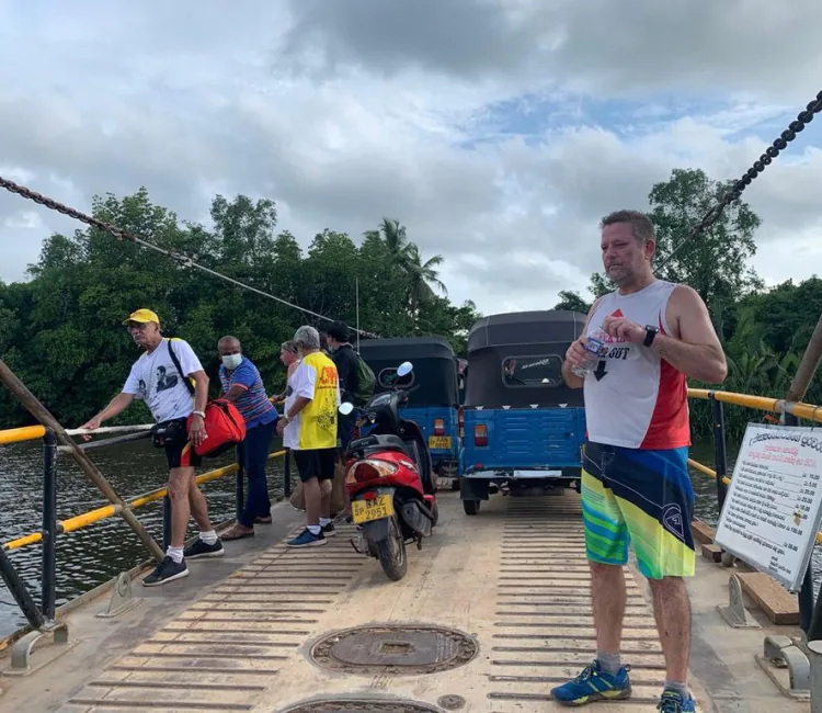 CH3 hashers crossing a river with local traffic on a small ferry